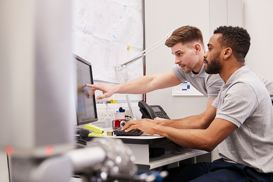 students doing research at a computer