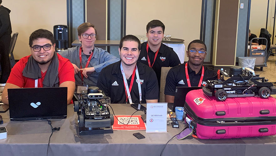 students engaged in the Quanser's American Control Conference Self-Driving Car Student Competition